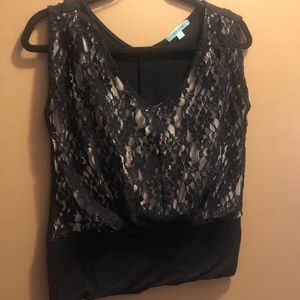 Laced front sleeveless shirt.